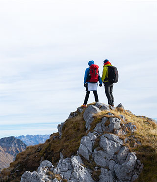 couple looking at scenery from mountaintop